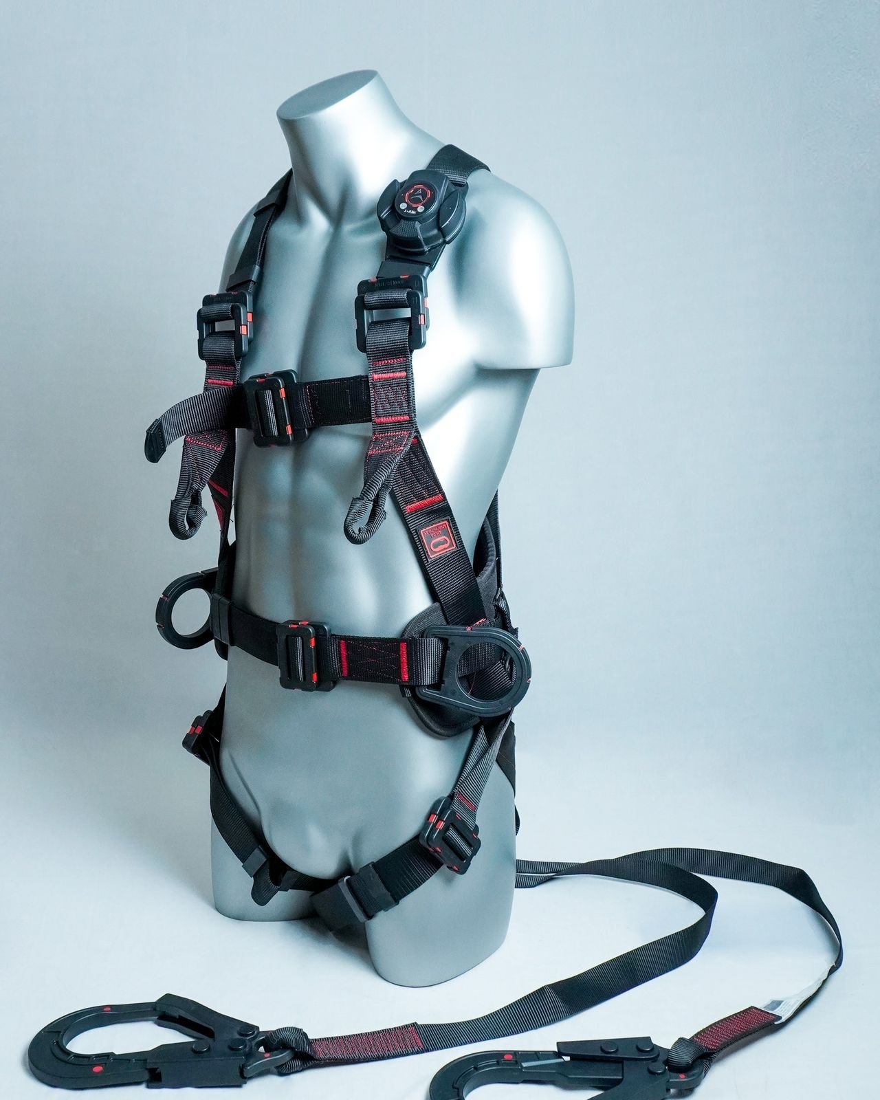 Kavach dielectric harness, side view showing dorsal attachment and waist pad